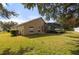 House exterior showcasing backyard, pool, and lush lawn at 914 Shadowmoss Dr, Winter Garden, FL 34787