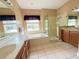 Elegant bathroom with double vanity, soaking tub, and shower at 914 Shadowmoss Dr, Winter Garden, FL 34787