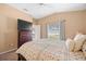 Bright bedroom with a dresser, TV, and backyard view at 914 Shadowmoss Dr, Winter Garden, FL 34787