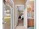 Hallway view of bedroom and bathroom with backyard access at 914 Shadowmoss Dr, Winter Garden, FL 34787