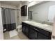 Bathroom with double vanity and shower at 376 Willet St, Haines City, FL 33844