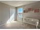 Bright bedroom with a view, featuring a writing desk, closet, and decorative shelves at 376 Willet St, Haines City, FL 33844