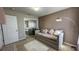 Well-decorated bedroom featuring a neutral color palette, modern lighting, and a mirror closet at 376 Willet St, Haines City, FL 33844