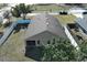 Aerial view of a home's back and screened patio at 110 Oak St, Clermont, FL 34711