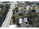 Aerial view showing a single-Gathering home with a fenced yard and driveway at 110 Oak St, Clermont, FL 34711