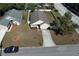 Aerial view of a house with a yard, driveway, and street at 110 Oak St, Clermont, FL 34711