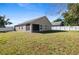 Single-story home with a large backyard and screened patio at 110 Oak St, Clermont, FL 34711