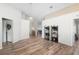 Bright dining room with wood-look floors and access to kitchen at 110 Oak St, Clermont, FL 34711