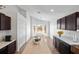 Kitchen with island, dark cabinets, and marble countertops at 110 Oak St, Clermont, FL 34711