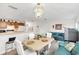 Dining area with table and chairs next to kitchen at 1209 W 6Th St, Sanford, FL 32771