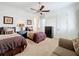 Spacious bedroom with two twin beds, a dresser, and a ceiling fan at 12812 Jacob Grace Ct, Windermere, FL 34786