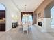 Elegant dining room features a large table, chandelier, and fireplace at 12812 Jacob Grace Ct, Windermere, FL 34786