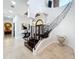 Grand entryway with a curved staircase and ornate railing at 12812 Jacob Grace Ct, Windermere, FL 34786