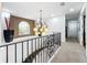 Elegant hallway with ornate chandelier and staircase at 12812 Jacob Grace Ct, Windermere, FL 34786