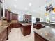 Large kitchen with center island, ample cabinetry, and granite countertops at 12812 Jacob Grace Ct, Windermere, FL 34786