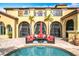 Mediterranean style villa featuring a beautiful pool and outdoor seating area for entertaining at 12812 Jacob Grace Ct, Windermere, FL 34786