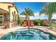 Luxury backyard with inviting pool, outdoor kitchen, and stylish lounge chairs, perfect for relaxation at 12812 Jacob Grace Ct, Windermere, FL 34786