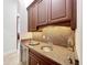 Butler's pantry with granite countertop and sink, features under-cabinet lighting at 12812 Jacob Grace Ct, Windermere, FL 34786