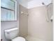 Close up of updated shower with tiled walls and showerhead with matching fixtures at 13111 Point O Wood Ct, Orlando, FL 32828