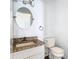 Cozy half bathroom featuring granite countertop, vanity, mirror, and toilet at 13111 Point O Wood Ct, Orlando, FL 32828