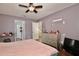 Bright bedroom with a view of the hallway and stairs at 13111 Point O Wood Ct, Orlando, FL 32828