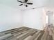 Bedroom featuring modern flooring, ceiling fan, and neutral walls at 13111 Point O Wood Ct, Orlando, FL 32828