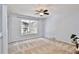 Large bedroom with carpeting and window with a view at 13111 Point O Wood Ct, Orlando, FL 32828