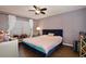 Spacious bedroom with ceiling fan and neutral walls at 13111 Point O Wood Ct, Orlando, FL 32828