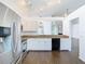 Modern kitchen with white cabinetry, granite countertops, and stainless-steel appliances at 13111 Point O Wood Ct, Orlando, FL 32828