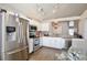 Updated kitchen featuring stainless steel appliances and granite countertops at 13111 Point O Wood Ct, Orlando, FL 32828