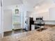 Modern kitchen features stainless steel appliances, granite countertops, and ample cabinet space at 13111 Point O Wood Ct, Orlando, FL 32828