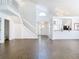 Inviting living room with a staircase to the second floor and lots of natural light at 13111 Point O Wood Ct, Orlando, FL 32828
