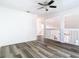 Bright and spacious living room featuring modern floors and ample natural light at 13111 Point O Wood Ct, Orlando, FL 32828