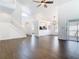 Spacious living room with wood-look floors and an open layout to the kitchen at 13111 Point O Wood Ct, Orlando, FL 32828