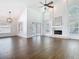 Open floor plan in living room offers a fireplace and natural lighting at 13111 Point O Wood Ct, Orlando, FL 32828