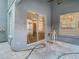 Covered patio with sliding glass doors offers indoor-outdoor flow at 13111 Point O Wood Ct, Orlando, FL 32828