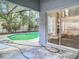 Outdoor area features a screened-in pool and patio at 13111 Point O Wood Ct, Orlando, FL 32828