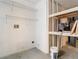 Practical utility room equipped with shelving for storage at 13111 Point O Wood Ct, Orlando, FL 32828