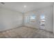 Bright bedroom with carpet, windows, and private balcony at 13552 Autumn Harvest Ave, Winter Garden, FL 34787