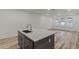 Kitchen island with sink and white quartz countertop at 13552 Autumn Harvest Ave, Winter Garden, FL 34787