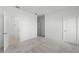 Large bedroom with an adjacent walk-in closet and grey carpet at 13556 Autumn Harvest Ave, Winter Garden, FL 34787