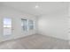 Spacious bedroom with private balcony access and neutral carpeting at 13556 Autumn Harvest Ave, Winter Garden, FL 34787