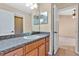 Bathroom with single vanity and access to bedroom at 140 Gladesdown Ct, Deland, FL 32724