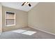 Well-lit bedroom with large window and carpet at 140 Gladesdown Ct, Deland, FL 32724