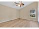 Bright bedroom with vaulted ceiling, ceiling fan, and wood-look flooring at 140 Gladesdown Ct, Deland, FL 32724