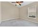 Bright bedroom with ceiling fan and window blinds at 140 Gladesdown Ct, Deland, FL 32724