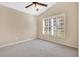 Bedroom with ceiling fan, window with shutters, and carpeted floor at 140 Gladesdown Ct, Deland, FL 32724