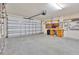 Garage with workbench and storage at 140 Gladesdown Ct, Deland, FL 32724