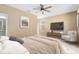 Spacious bedroom with ceiling fan and room for a king-size bed at 1407 Retreat Cir, Clermont, FL 34714