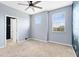 Bright bedroom with window and ceiling fan at 1407 Retreat Cir, Clermont, FL 34714